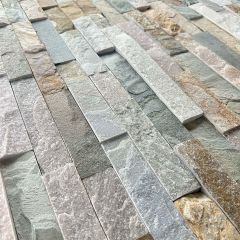 Picture of oyster split face tiles showing the undulating structure of the tile and muti natural tones of cream, brown, grey and rust