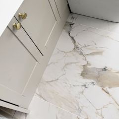 Vermont Gold Matt porcelain tiles in a small bathroom with gold accessories